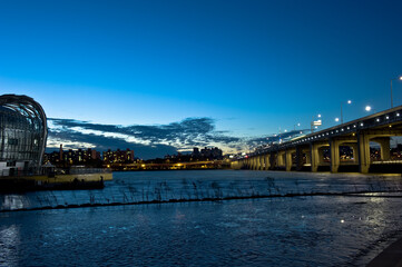 The beautiful sunset view of river and grand bridge.