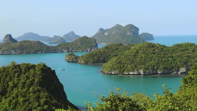 Thailand National Marine Park aerial view in Pacific Ocean. Majestic hilly islets with green grass on water surface. Thai natural wonders wildlife in Mu Koh Angthong. Footage panoramic shot in 4K, UHD