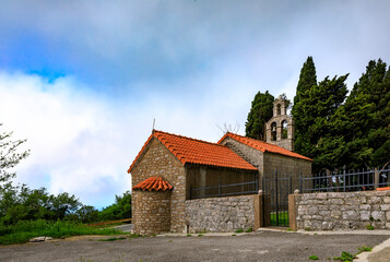 Traditional stone Crkva Svetog Krsta or Church of Holy Christ in the mountains by Novoselje, Montenegro