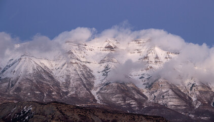 Mount Timpanogos Shrouded in breaking low lying clouds.