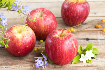 background texture super fruits red apple healthy foods for diet with flower arrangement flat lay style on wooden