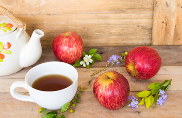 background texture super fruits red apple healthy foods for diet and hot tea with flower arrangement flat lay style on wooden