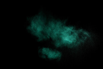 Aquamarine powder explosion on black background. Colored powder cloud. Colorful dust explode. Paint  Holi.