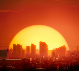 Sunset Kyiv town silhouette skyscrapers, buildings, homes. Red tones background sky with big golden sun set at European capital urban illustration architecture. Metropolis of Ukraine panorama shot