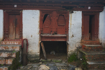 Fototapeta na wymiar Old abandoned house with broken wooden windows.