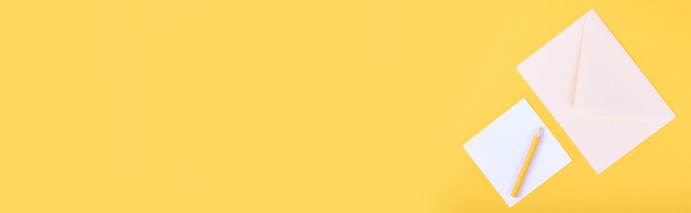 Pencil and letter with envelope, writing mail, isolated on yellow background, copy space template, banner.