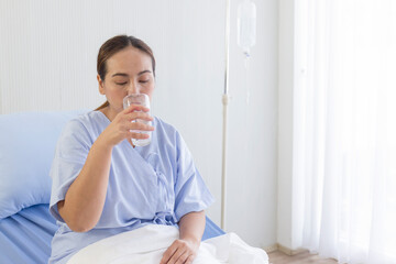 Asian female patients drinking water