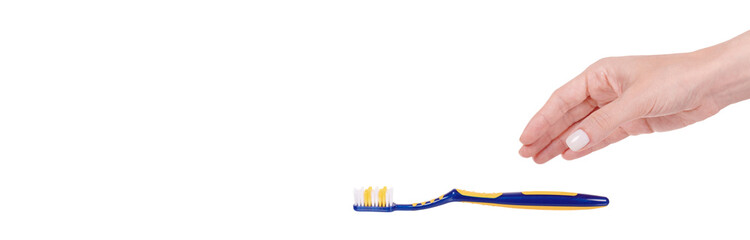 Hand with blue and yellow plastic toothbrush, dental care. Isolated on white background, copy space template, banner.