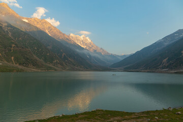 Fototapeta na wymiar beautiful lake saiful malook and mountains reflection on water - KPK lake in the summer evening with clear sky