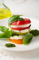 Caprese salad on white table