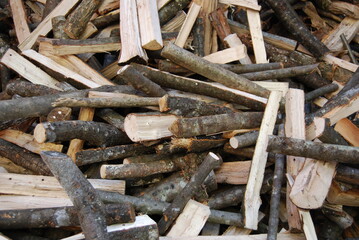 Chopped wood background. Stack of firewood