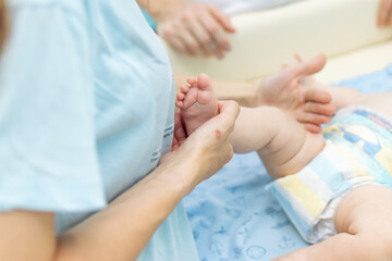 Fototapeta na wymiar Baby massage, close up shot. Child massage, newborn.