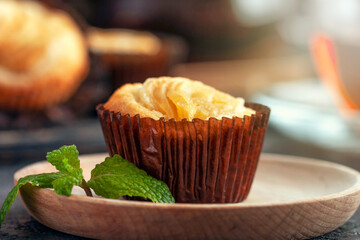 Rice flour cupcake with apple slices. The cupcake lies on a wooden plate. Apple filling..Delicious homemade cupcake. Baking for tea and a cafe.