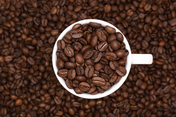 Creative espresso. Coffee beans in white cup and background