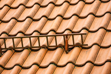 Tiles roof with snow guards safety.
