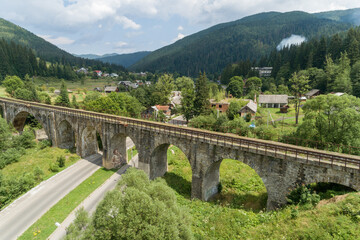 Aerial view of railway viaduct in Vorokhta village, Carpathians mountains, Ukraine