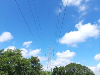 Electricity Tower. High voltage post or High voltage tower. View of  fields with high-voltage...