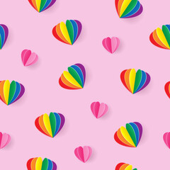 Obraz premium Seamless pattern with pink and rainbow paper heart on light pink background
