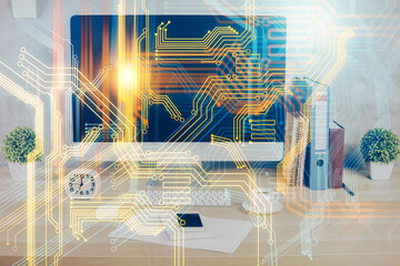 Double exposure of desktop with computer and world map hologram. International data network concept.