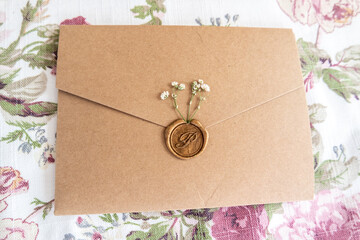 Envelope with wax seal and little dry flowers