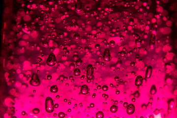 Bubbles of different shapes in pink color, water droplets and abstract background. Bubbles pattern...