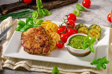 Delicious pork steak with herbs sauce