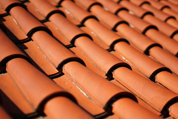 Texture detail of modern orange clay roof tiles used for house roofing