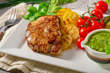 Delicious pork steak with herbs sauce