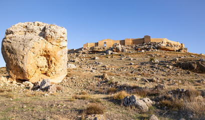 big boulder in the slope to the medieval castle (Caliphate fortress) in Gormaz, province of Soria,...