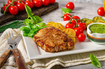 Delicious pork steak with herbs sauce