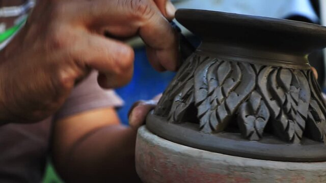close up potter artist working on clay pottery sculpture fine art in thailand 