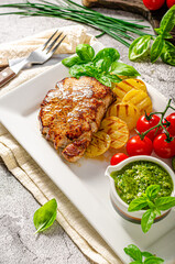 Delicious pork steak with herbs sauce