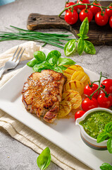 Delicious pork steak with herbs sauce