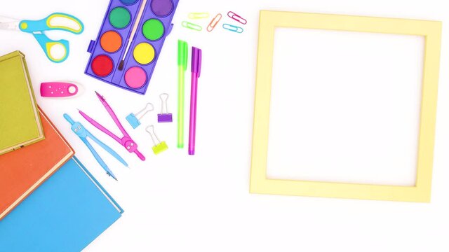 School stationery and yellow transparent frame for text appear on white theme. Stop motion 