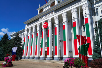 Tiraspol, Transnistria- August 25, 2020: russian phrase "house of Soviets", city hall is decorated with state flags and banners to celebrate the 30th anniversary of independence