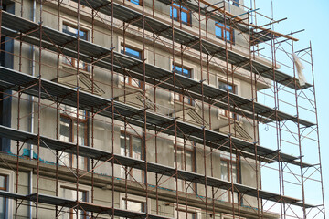 Fototapeta premium scaffolding and new building as background