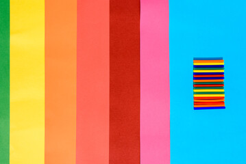 Colorful background of plastic bars, silicone glue, on a background of colored lines.