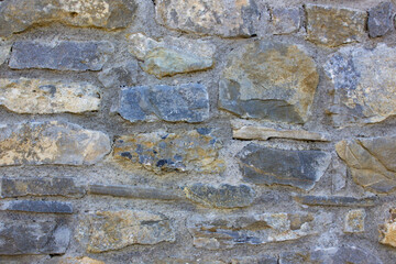 Texture of a natural big stone wall. Old castle stone wall texture background.