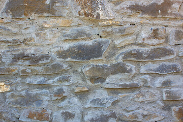 Texture of a natural big stone wall. Old castle stone wall texture background.
