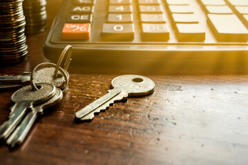 Financial accounting for Home loans,Keys and money calculator on table