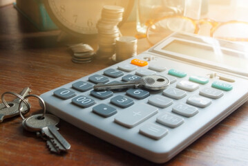 Financial accounting for Home loans,Keys and money calculator on table