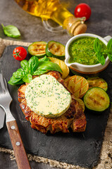 Delicious pork steak with herb butter