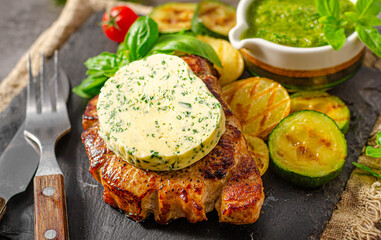 Delicious pork steak with herb butter