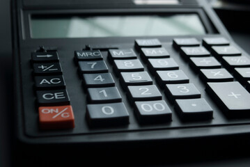 Financial accounting, money calculator on table