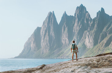 Man tourist enjoying landscape in Norway adventure travel active healthy lifestyle outdoor summer...