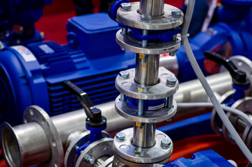 Close up of house heating system with many steel pipes, manometers and metal tubes.
