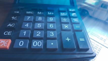 Financial accounting, money calculator on table