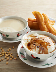 Soya bean curd or soy milk pudding with Chinese fritters and soy beans
Description