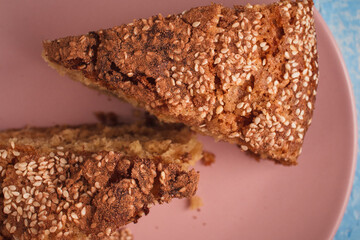Slices of homemade sponge cake with cinnamon and sesame.