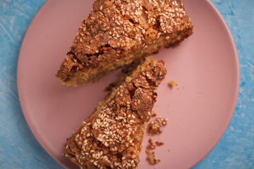 Slices of homemade sponge cake with cinnamon and sesame.